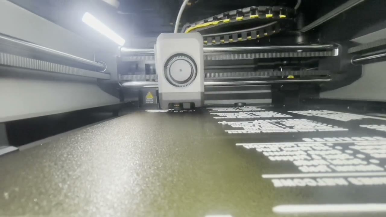 White lettering for a welcome sign being 3D printed