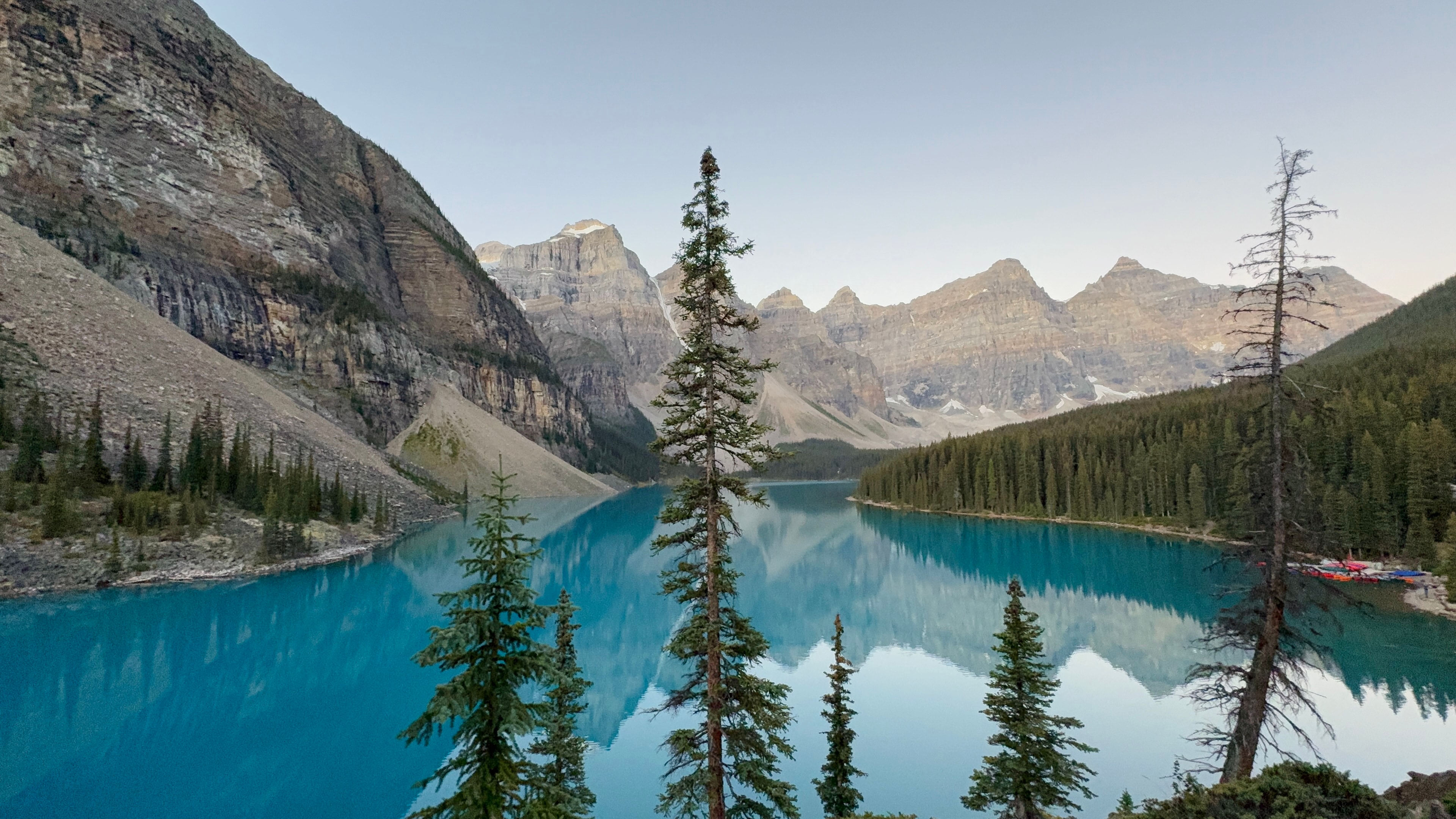 A turquoise Canadian lake beneath mountain peaks